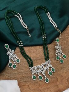AD white pendent and dark green beads set