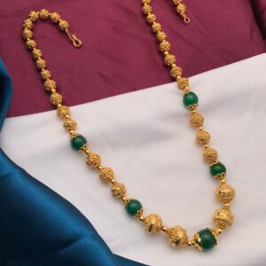 gold polish balls with green beads