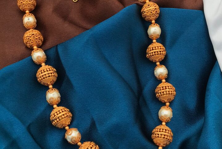 gold polish balls with white beads mala