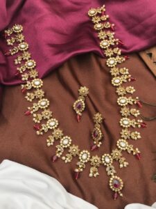 long necklace set with white and red stones